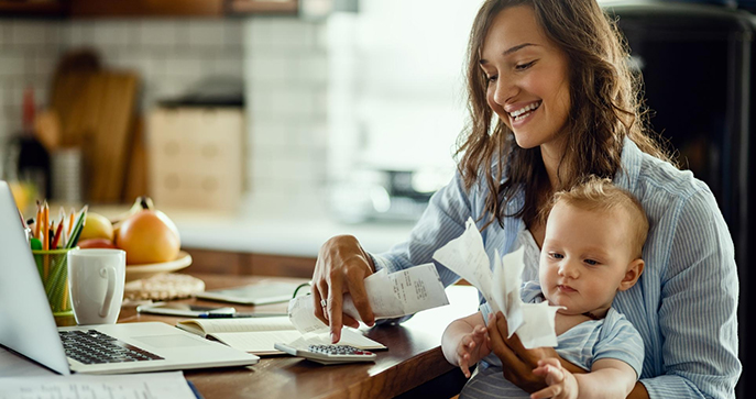 Woman with baby in kitchen